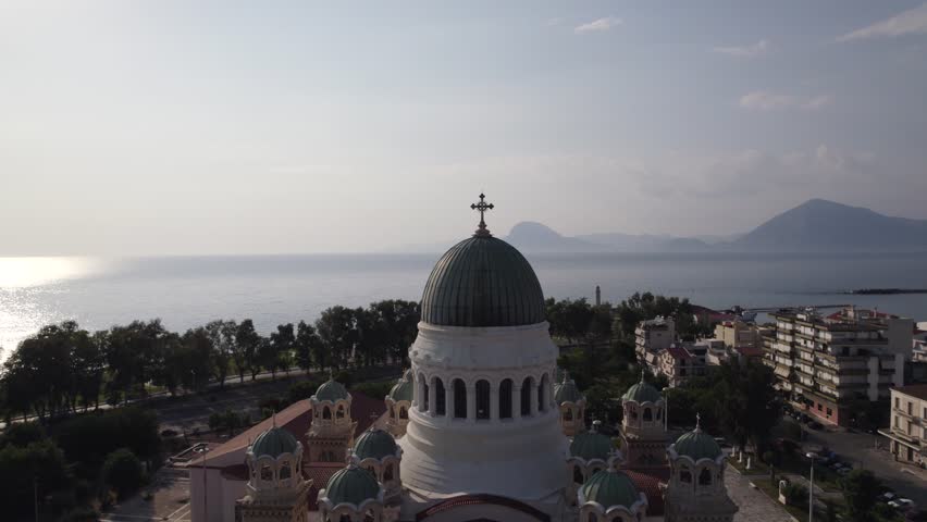 Aerial view tilting in front of the Cathedral of Saint Andrew in Patras, in sunny Greece