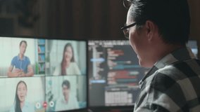 Close Up Of Asian Male Programmer Waving Hand Having A Meeting On Desktop Computer While Creating Software Engineer Developing App, Program, Video Game At Home. Terminal With Coding Language 
 - Powered by Shutterstock - Get 15% off with code: PIKWIZARD15