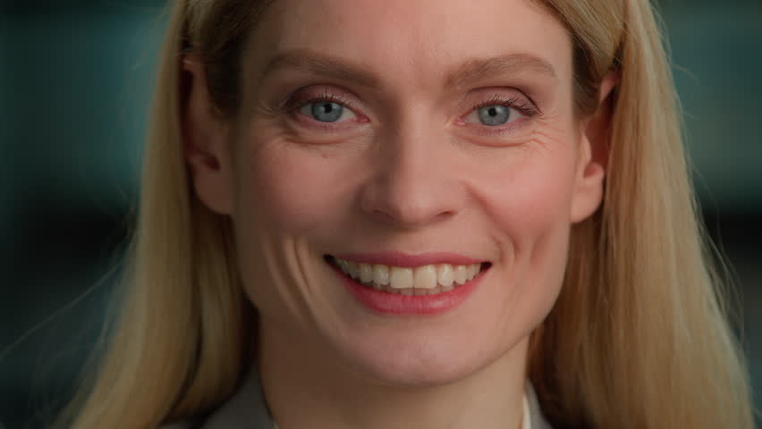 Serious Caucasian adult middle-aged businesswoman executive posing for business portrait in office. Female face close up smiling toothy. 40s woman in formal outfit looking to camera lady manager smile | Shutterstock HD Video #1099041917