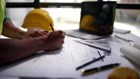 lose up of hands working and calculations estimate for cost and materials planning on paperworks and floor plan drawings about design architectural and engineering for houses and buildings. - Powered by Shutterstock - Get 15% off with code: PIKWIZARD15
