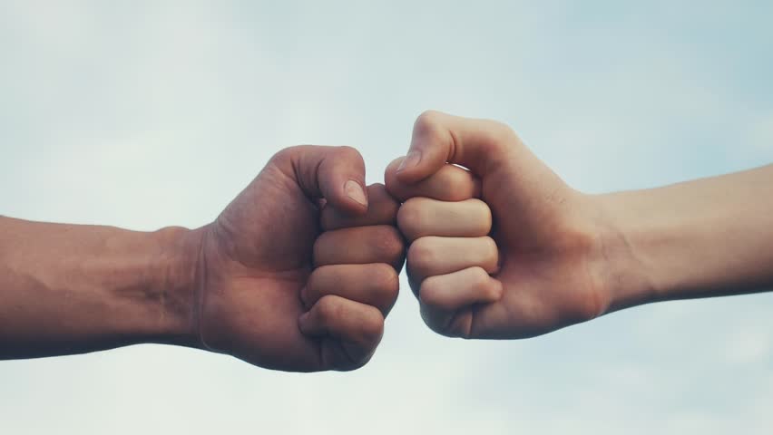 teamwork concept. fist to fist commit solidarity respect and brotherhood gesture. business team hands fists close-up. people of different skin colors partnership friendship teamwork lifestyle Royalty-Free Stock Footage #1099047239