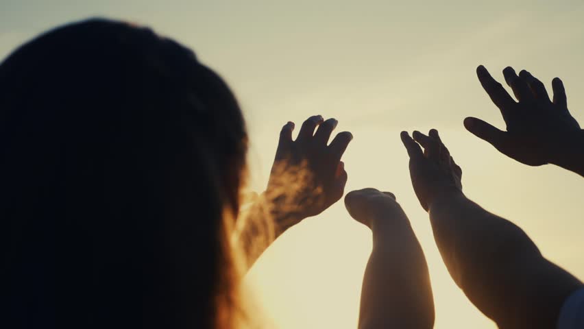 happy family people group pull hands to the sun teamwork. silhouette people party dancing recreation holiday. people at a music concert pull their hands up. lifestyle religion concept sunlight Royalty-Free Stock Footage #1099047247