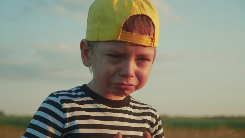 boy kid crying flowing tears a screaming dirty face. child son scream disappointed cranky. lifestyle domestic violence concept. close-up toddler roared all in tears Royalty-Free Stock Footage #1099047363