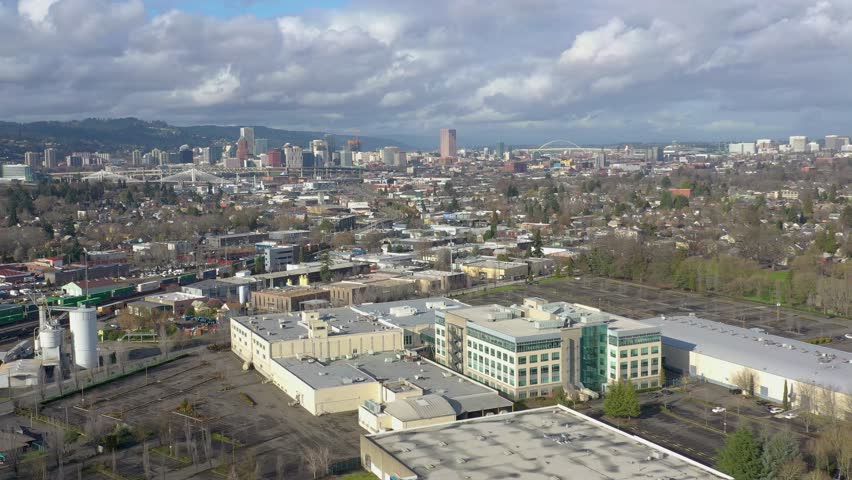 Descending drone shot of downtown Portland Oregon skyline.