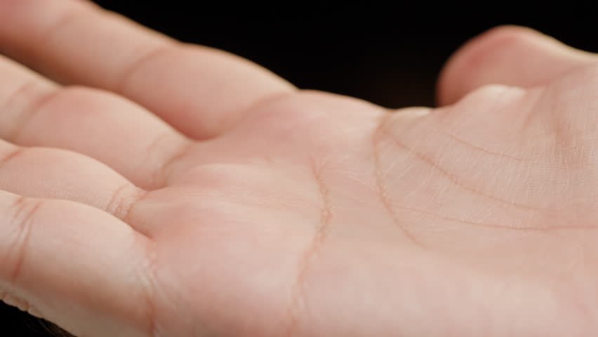 Human hand with lines, Palm reading, foretelling the future through the study of the palm, close up macro Royalty-Free Stock Footage #1099051569