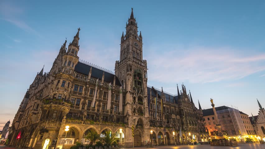 Munich (München) Germany time lapse 4K, city skyline night to day sunrise timelapse at Marienplatz new Town Hall Square Royalty-Free Stock Footage #1099053789