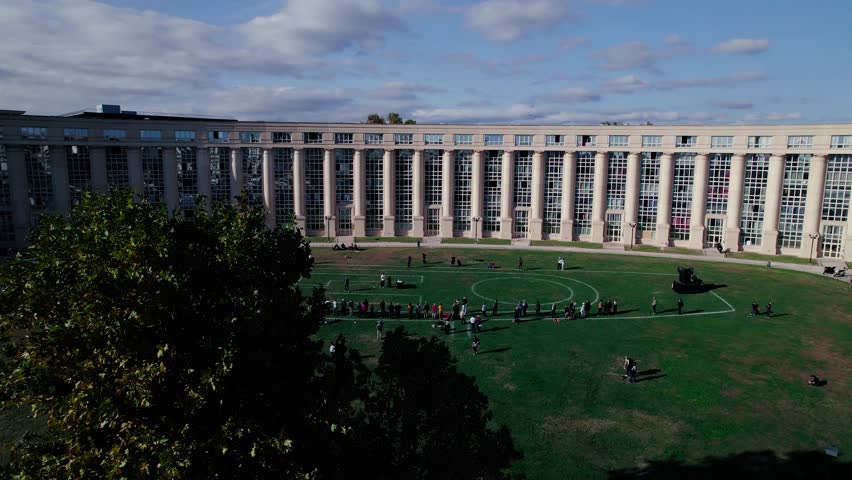 Rotating shot of a crowd spectating the future plans at the Zone Atristique Temporaire event