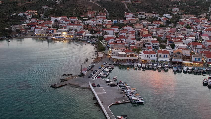 Aerial video of  Elafonisos main village during sunset. Located in south  Peloponnese Elafonisos is a small island very famous for the paradise sandy  beaches and the turquoise waters.