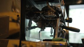 4K Asian man barista making hot espresso shot from coffee maker machine on counter at cafe. Coffee shop owner brewing black coffee serving to customer. Small business restaurant food and drink concept - Powered by Shutterstock - Get 15% off with code: PIKWIZARD15