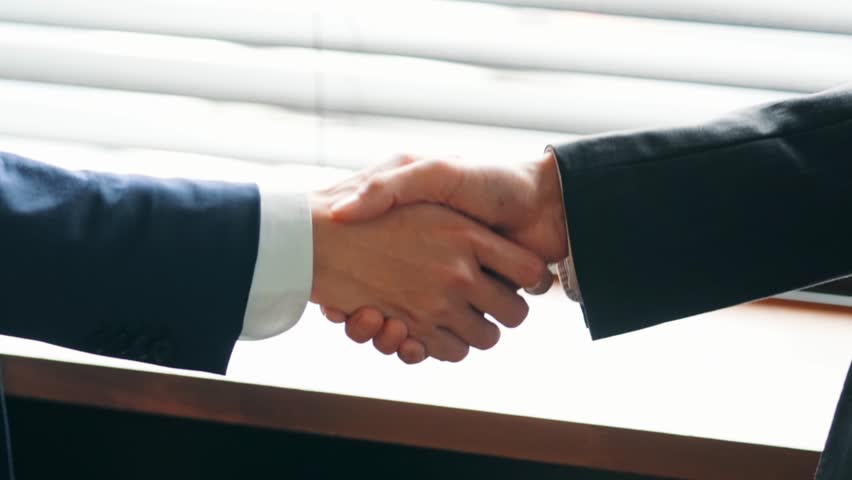 A collage of various business scenes. Transition from a shaking hands scene. Title template. Royalty-Free Stock Footage #1099068265
