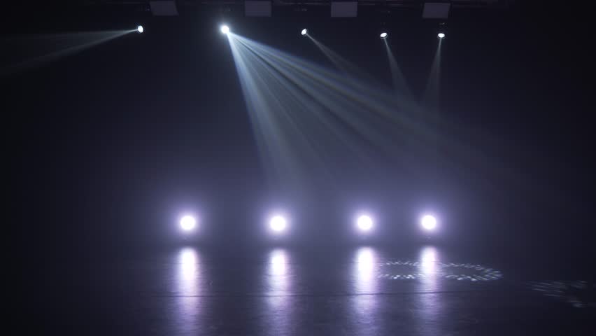 Stage lighting in the studio. Professional concert light on stage. Prerequisites for various projects. Lighting equipment in a nightclub. The concept of nightlife, music, entertainment and technology. Royalty-Free Stock Footage #1099073371