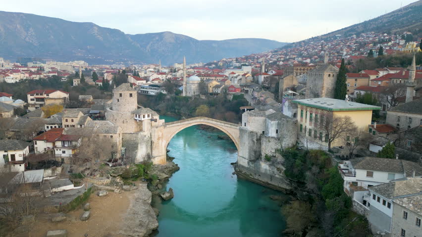 Mostar Bosnia and Herzegovina aerial skyline view drone footage view of old brdige in mostar old town river neretva drone footage. | Shutterstock HD Video #1099074517