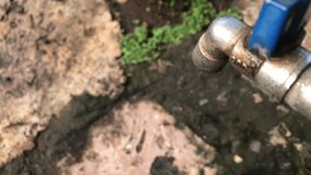 Video of fingers opening water faucet