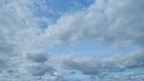 Beautiful sky background. Abstract look of natural white cumulus and cirrus on different layers clouds showing wind direction on blue sky. Timelapse. - Powered by Shutterstock - Get 15% off with code: PIKWIZARD15