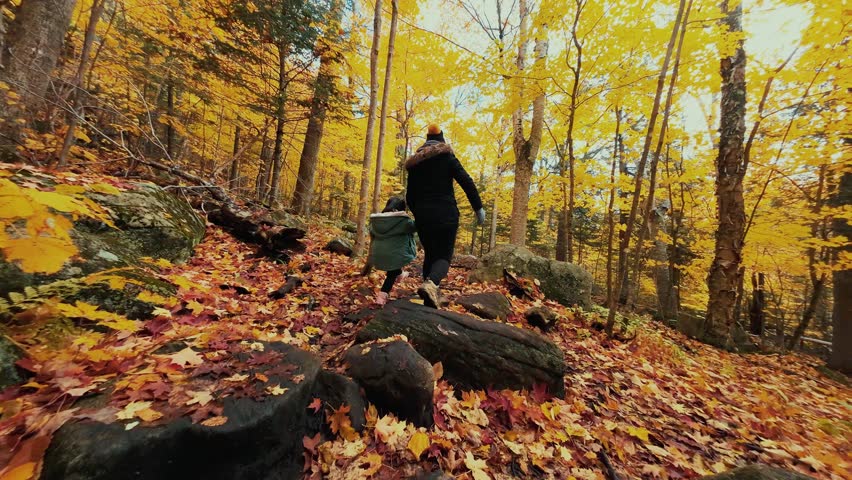 Mother and daughter hiking with beautiful Autumn foliage in Adirondack Upper New York State