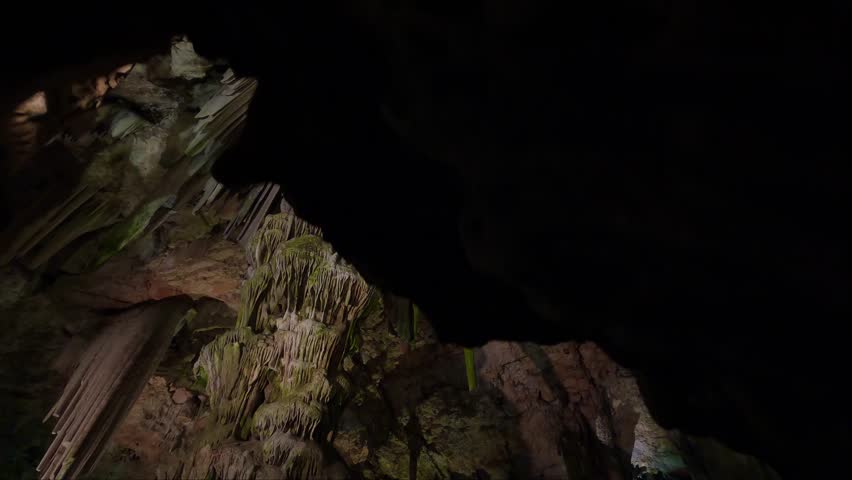 Saint Michael's Cave with colorful lights with Angel. Natural Rock Formation. Gibraltar, UK. Nature Background Royalty-Free Stock Footage #1099084393