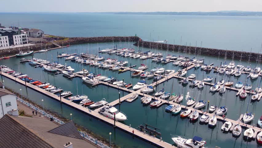 Aerial video of boats and yachts in Carrickfergus Marina Co Antrim Northern Ireland 