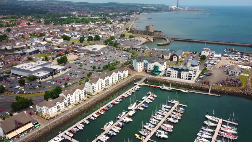 Aerial video of boats and yachts in Carrickfergus Marina Co Antrim Northern Ireland 