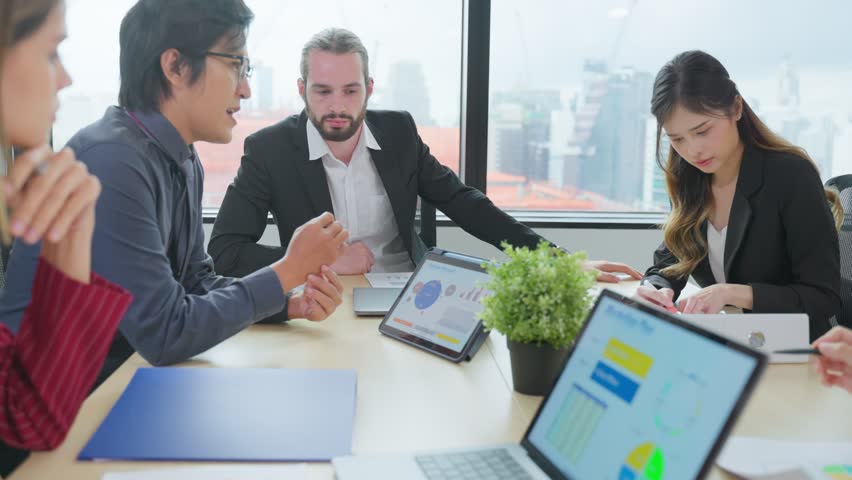 Group of multi-Ethnic businessman and businesswoman working in office. Attractive employee brainstorm and meeting as team, plan and discuss project in workplace. Corporate of modern colleagues concept | Shutterstock HD Video #1099090673