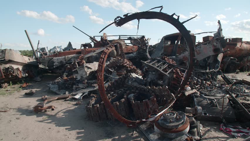March, 2022. Bucha, Ukraine. Devastated blown-up private vehicles of killed Ukrainian people after Russian invasion. Close-up view of abandoned broken and burnt vehicles. High quality 4k footage