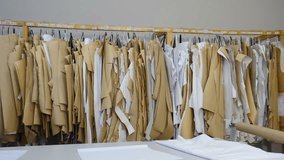 Ready cloth stencils. Making outline frame in sewing workshop or tailoring factory. Production process in garment factory, Textile factory equipment. 4 k video - Powered by Shutterstock - Get 15% off with code: PIKWIZARD15