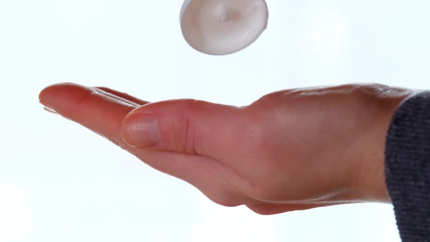 Hand cream. Hands and cream from a tube on a white blurred background.slow motion. Hand skin care. High quality 4k footage | Shutterstock HD Video #1099095155