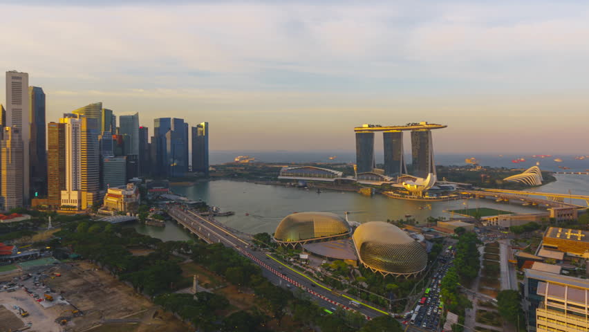 Singapore Sunset Beautiful Time lapse of day to night of Singapore city skyline from aerial and high angle overlooking Marina bay and CBD area. Prores Full HD Timelapse. Royalty-Free Stock Footage #1099096787