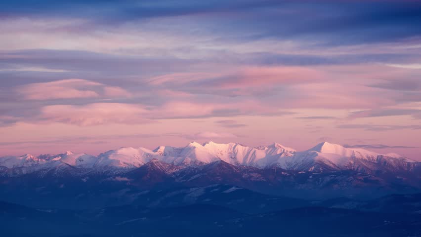 Snowy winter time-lapse of High Tatras, Slovakia at sunset.Colourful clouds in pastel colours. Royalty-Free Stock Footage #1099097991