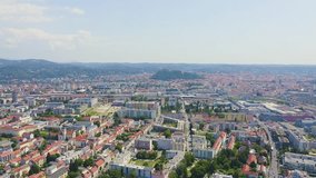 Inscription on video. Graz, Austria. The historic city center aerial view. Mount Schlossberg (Castle Hill). Heat burns text, Aerial View