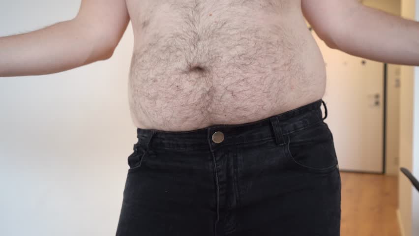 overweight man dancing at home. Obesity 2 degrees. Big belly, shaking belly. High quality 4k footage
