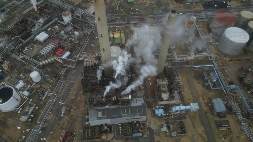 Oil refinery, aerial view. Diesel and gasoline production. Toxic emissions to the atmosphere, harm to the environment.