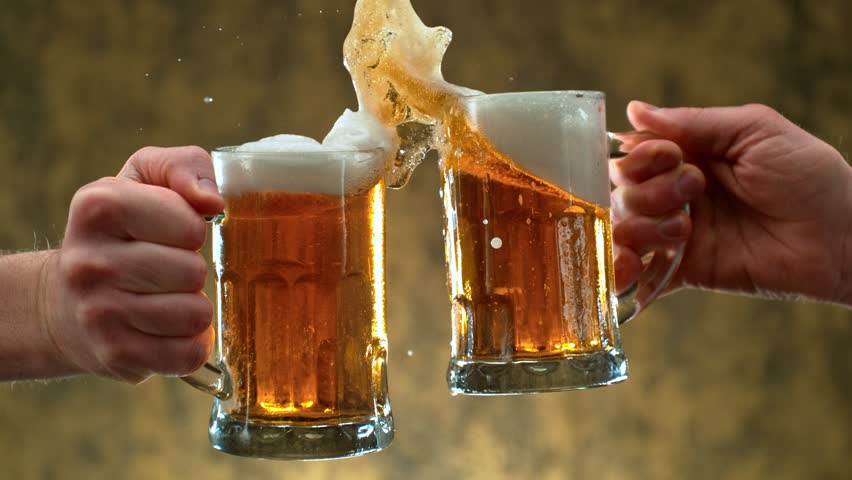 Super slow motion of beer glasses in cheers gesture. Speed ramp effect. Filmed on high speed cinema camera, 1000 fps.
