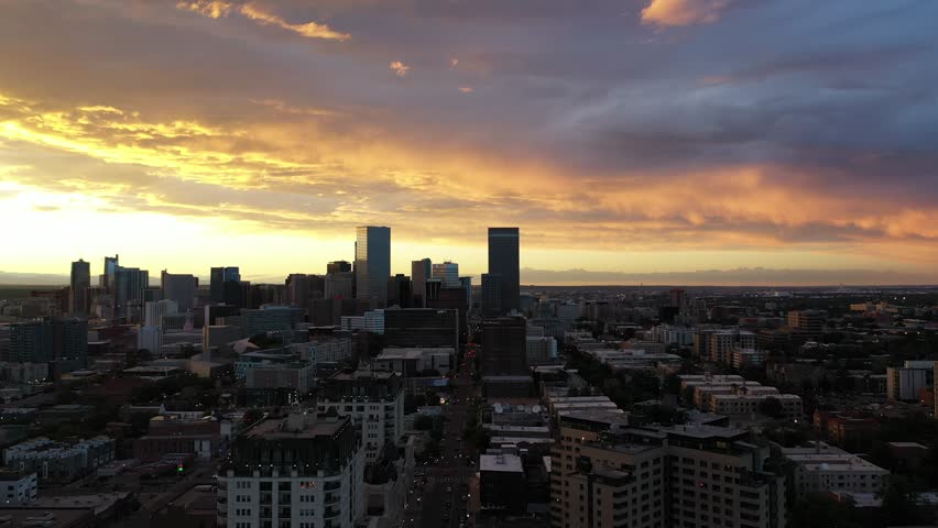 A dynamic drifting aerial footage of the sunset over Capitol Hill in Denver, Colorado.