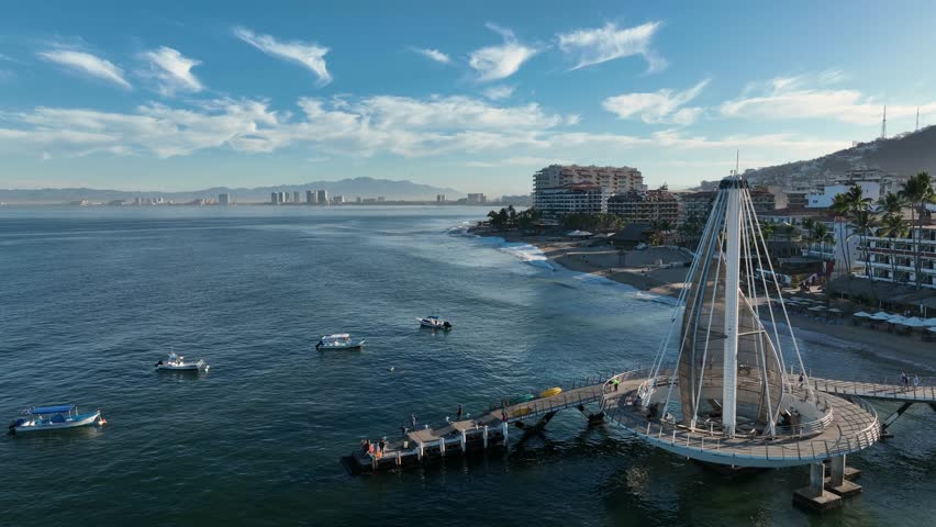 Playa De Los Muertos beach and pier close to famous Puerto Vallarta Malecon, the city largest public beach. Aerial drone fly above view high resolution 4k Royalty-Free Stock Footage #1099112697