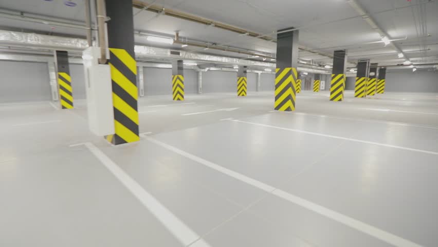 Empty underground parking. Modern empty underground parking. Bright modern car park | Shutterstock HD Video #1099115591
