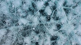 Frozen methane bubbles and cracks in the ice on Lake Baikal Siberia Russia. Natural cold background of ice. Winter abstract background. High quality 4k footage - Powered by Shutterstock - Get 15% off with code: PIKWIZARD15