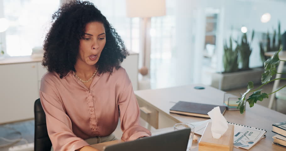 Black woman, covid and sinus in office with sneeze, tissue and runny nose while working on laptop. Business woman, allergies and unwell corporate employee sneezing and suffering flu, cold and allergy | Shutterstock HD Video #1099117975