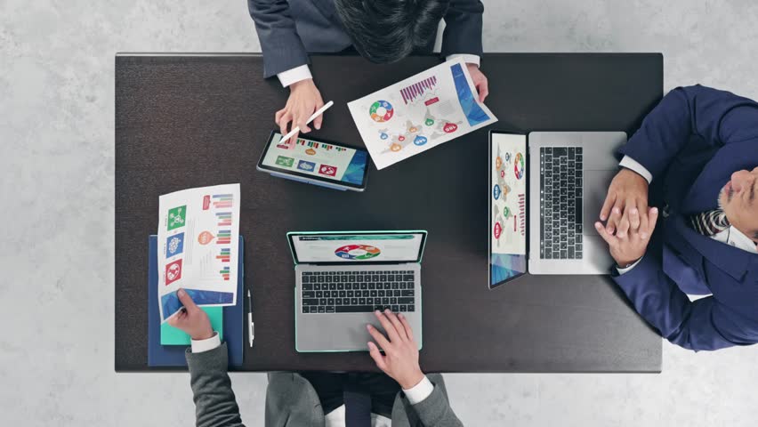 Group of people meeting in the office. Directly above view. | Shutterstock HD Video #1099118775