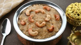 Pouring ghee on sakkarai pongal a traditional sweet based rice dish famous in South India.