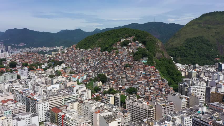Cantagalo and Pavao-Pavaozinho Favelas. Rio de Janeiro, Brazil. Aerial View. Drone Flies Forward Royalty-Free Stock Footage #1099127365