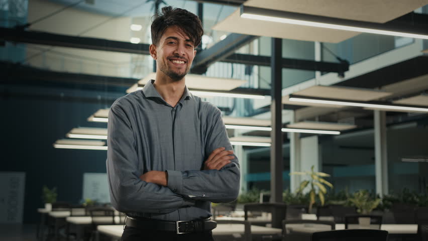 Smiling businessman indian arabian multiethnic 30s man posing in office with arms crossed. Professional agent business company owner executive manager entrepreneur investor adult male portrait indoors | Shutterstock HD Video #1099127609