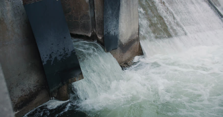 Rushing Water Flowing out of Dam Drainage Overflow Flood Gate. Storm Infrastructure Heavy Rain 4k | Shutterstock HD Video #1099132877