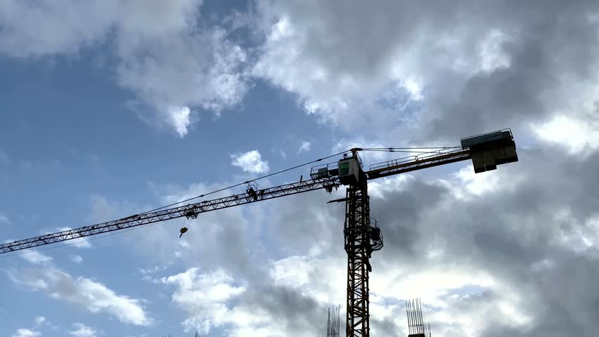 Construction crane working on construction site, crane 24 hours working for new building construction  Royalty-Free Stock Footage #1099134585
