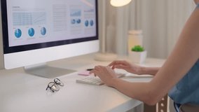 Smart Gen Z tech talent workforce typing SEO sale report on desktop PC happy work easy relax at home office. Remote WFH reskill upskill job MBA study of young people asia woman examine big data graph. - Powered by Shutterstock - Get 15% off with code: PIKWIZARD15