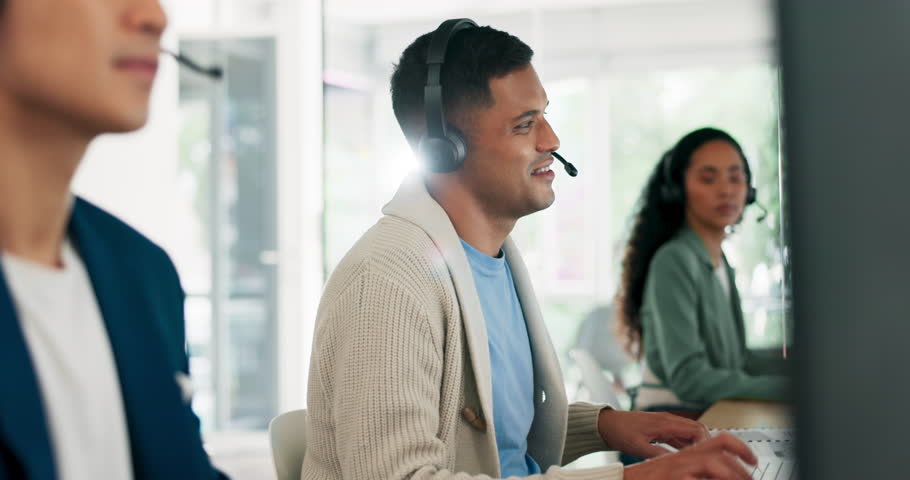 Call center, consulting and smile with businessman in office for telemarketing, customer service and technical support. Help desk, contact us and crm with employee and microphone for sales advisory Royalty-Free Stock Footage #1099150405