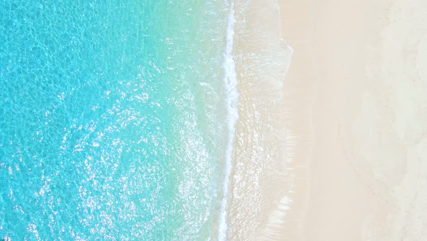 Tropical beach with white sand, turquoise ocean water, aerial view. Top view of paradise beach in tropics with blue sea | Shutterstock HD Video #1099150709