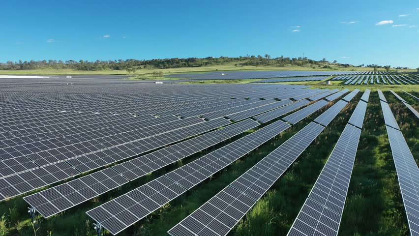 Drone shot of Solar Farm, flying over field of solar panels, shot at in afternoon, in Warwick Queensland Australia 4K Royalty-Free Stock Footage #1099151785