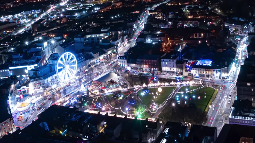 Aerial time lapse of Eire square, Galway, during Christmas and at night.
The shot reveals a big part of the city and its traffic.
Ireland