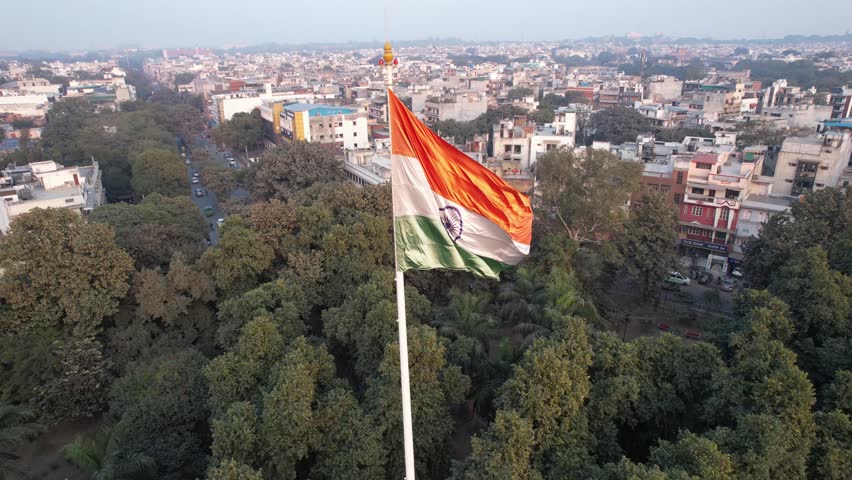 Aerial Drone footage of Indian Flag on a roundabout road in  Kamla Nagar  Shakti Nagar New Delhi India 