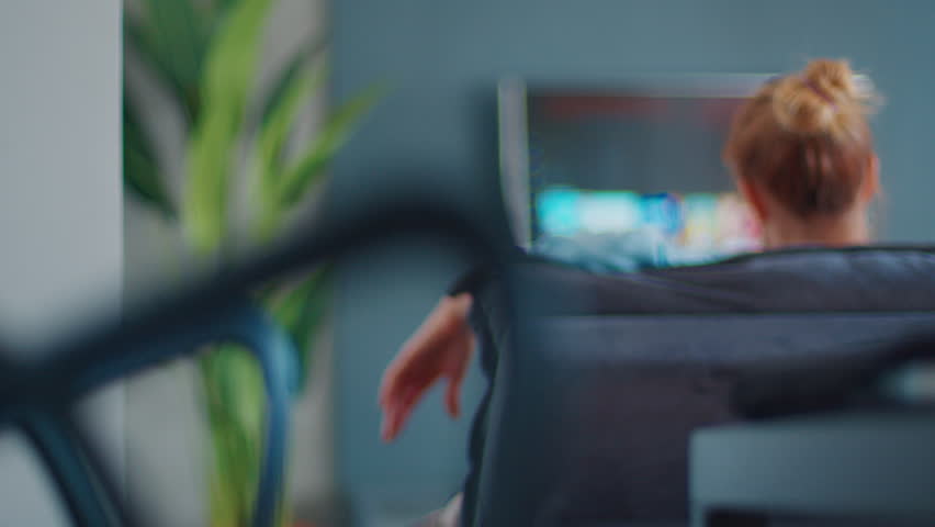 TV watch at home. Woman searches show on online streaming service and scrolls the screen | Shutterstock HD Video #1099162553